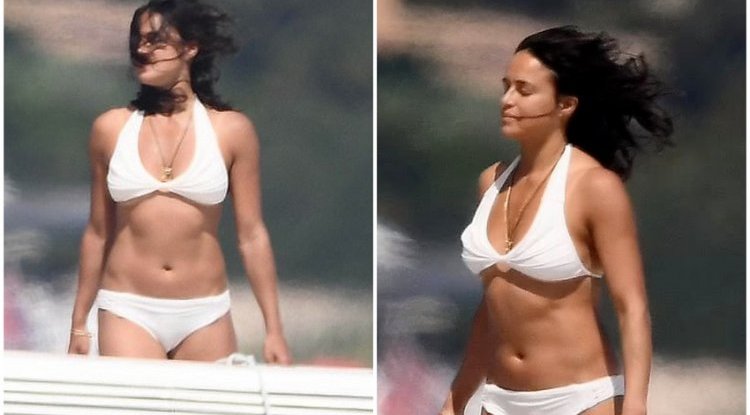 Michelle Rodriguez shows off her gym-honed figure in a white bikini on a Italian yacht
