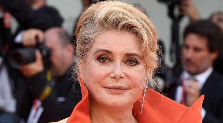 Catherine Deneuve sells 125 pairs of shoes at a charity auction
