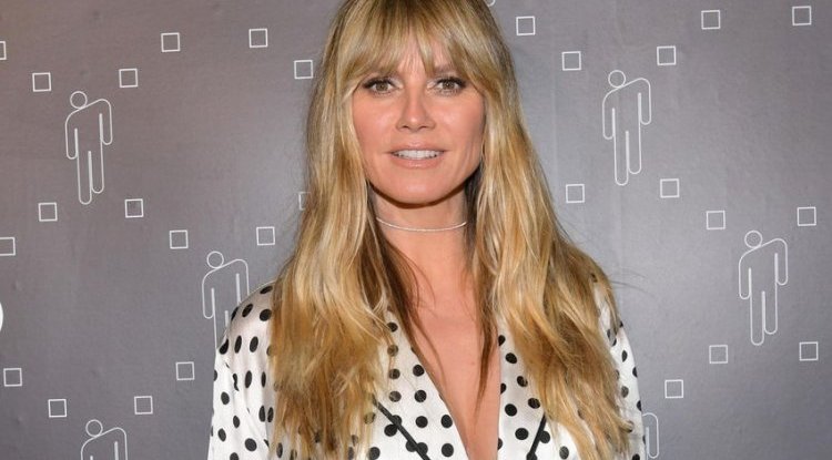 Heidi Klum is not hiding her shapely breasts