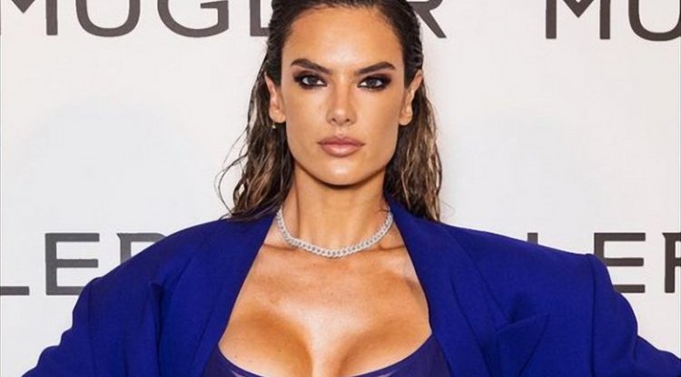 Alessandra Ambrosio turns heads in an electric blue see-trough dress in Paris