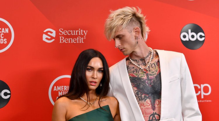 Megan Fox connected to her boyfriend by a chain