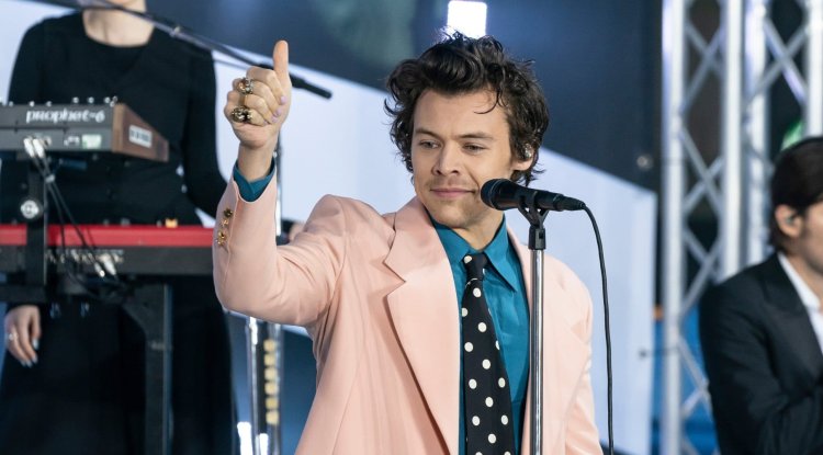 Harry Styles in bed while recording a new video