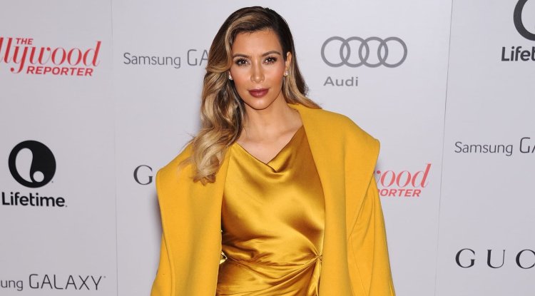 Kim Kardashian enchanted in a blue dress