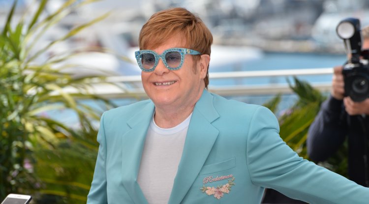 Why is Elton John in a wheelchair?