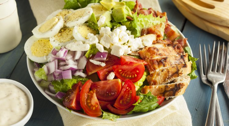 Summer salad with chicken and boiled eggs