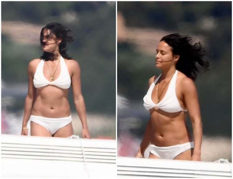 Michelle Rodriguez shows off her gym-honed figure in a white bikini on a Italian yacht