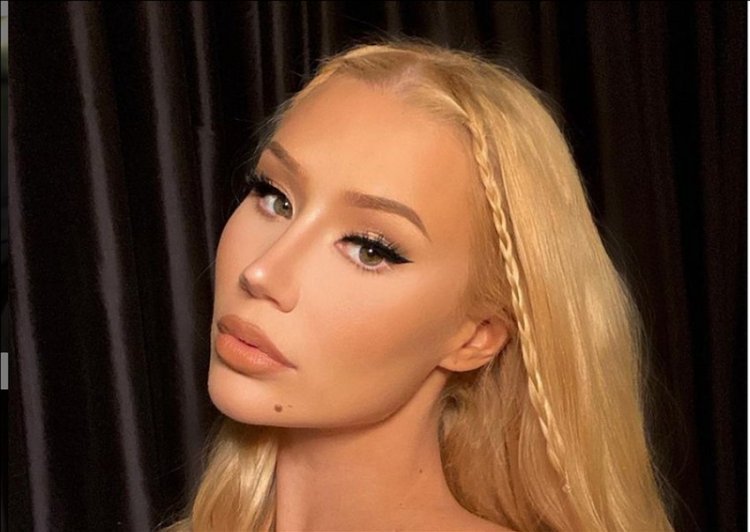 Although Iggy Azalea fiercely denies having bum implants, the latest photos could be proof that she isn't telling the truth