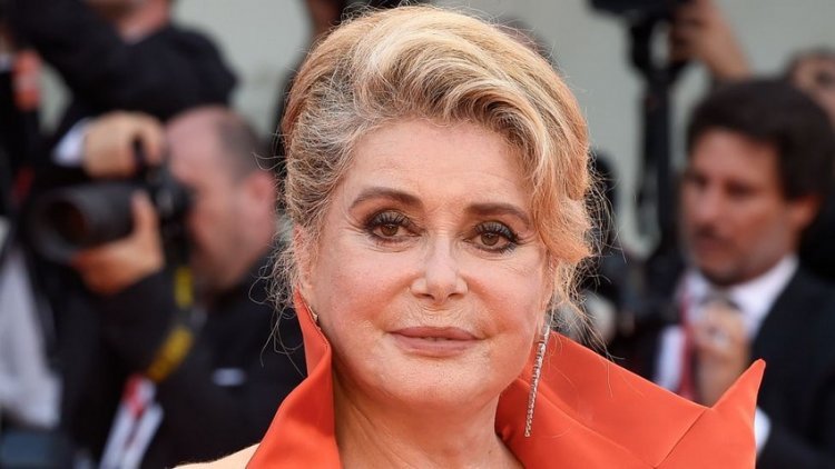 Catherine Deneuve sells 125 pairs of shoes at a charity auction