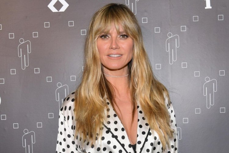 Heidi Klum is not hiding her shapely breasts