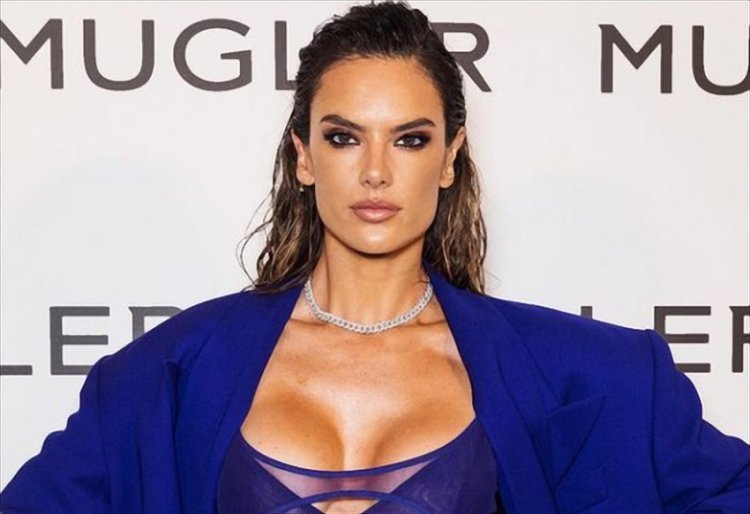 Alessandra Ambrosio turns heads in an electric blue see-trough dress in Paris