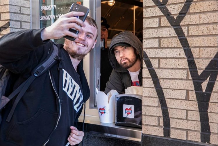 Eminem is one of the most popular rappers of all time and he serves spaghetti at the opening of his restaurant