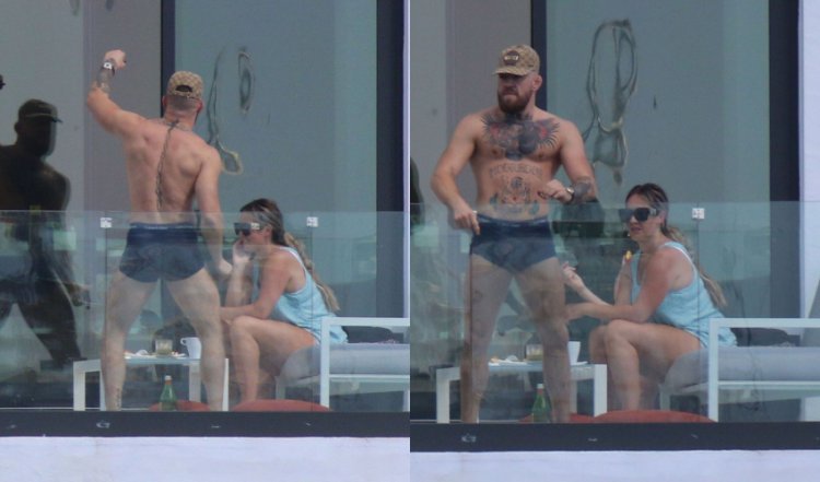 Conor McGregor paraded in front of his fiancée in boxer shorts as she watched him with a smile