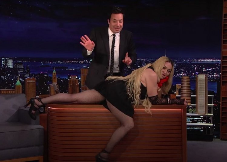 At the age of 64, Madonna flashes the audience and crawled on the table on 'The Tonight Show'