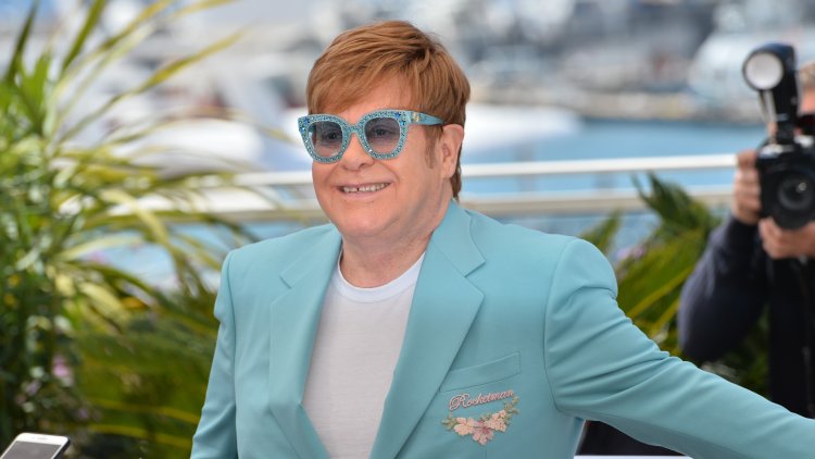 Why is Elton John in a wheelchair?