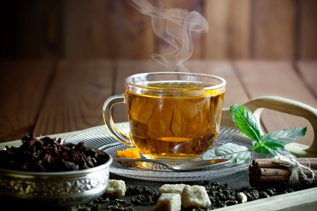 Why is it good to drink hot tea during the summer