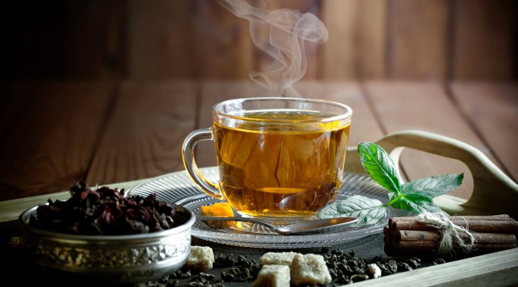 Why is it good to drink hot tea during the summer
