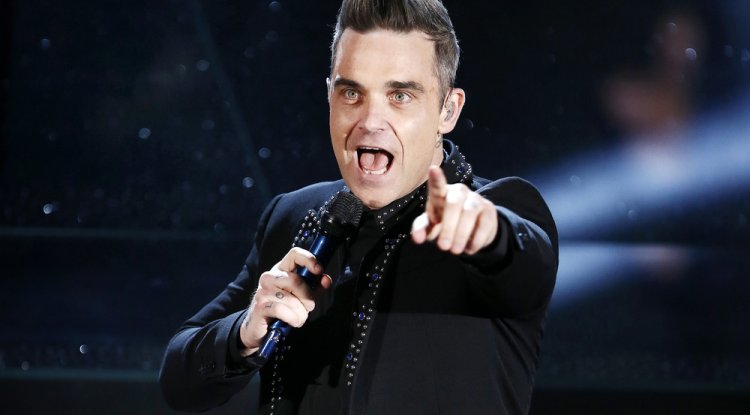 Robbie Williams talks about addiction in the biopic