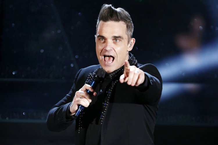 Robbie Williams talks about addiction in the biopic